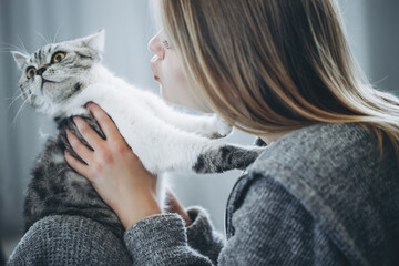 Young beautiful woman with cat. High quality photo