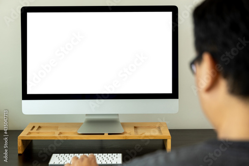 young man working Businessman using a desktop computer of the blank screen