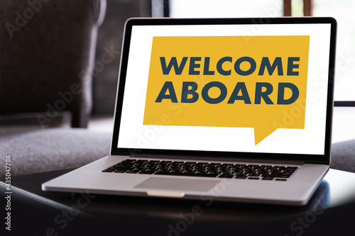 WELCOME ABOARD Business team hands at work with financial WELCOME ABOARD Concept photo