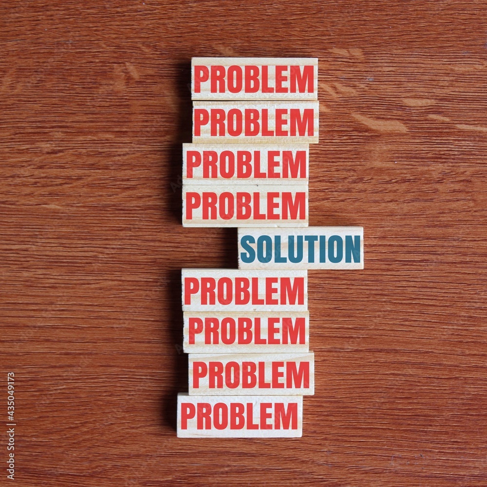 Concept of problem solving. Look for the solution inside the problem. Top view of wooden tiles with text PROBLEM and SOLUTION