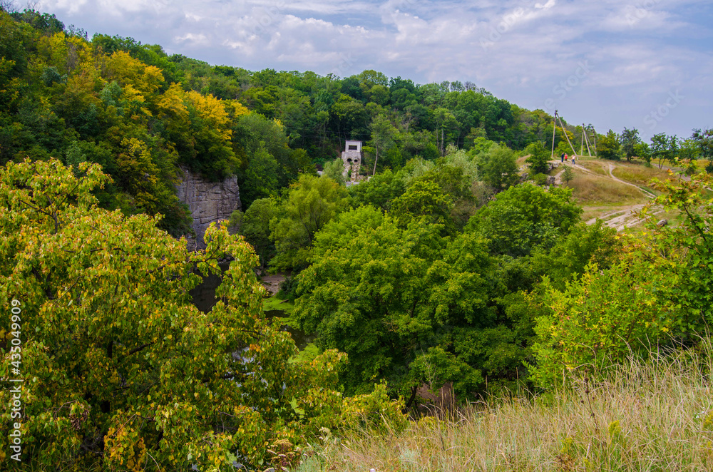 Beautiful river in a rocky canyon among the green nature, an old abandoned building, Buky Canyon Ukraine, the Hirskyi Tikych river
