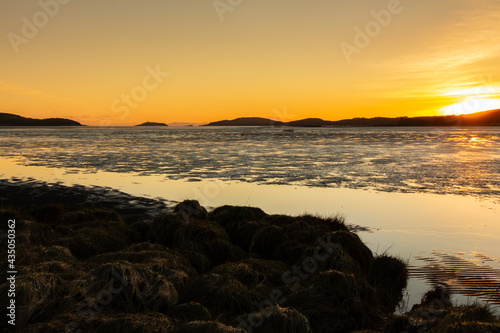 Golden winter sunset over Kirkcudbright Bay mudflats and the Dee estuary
