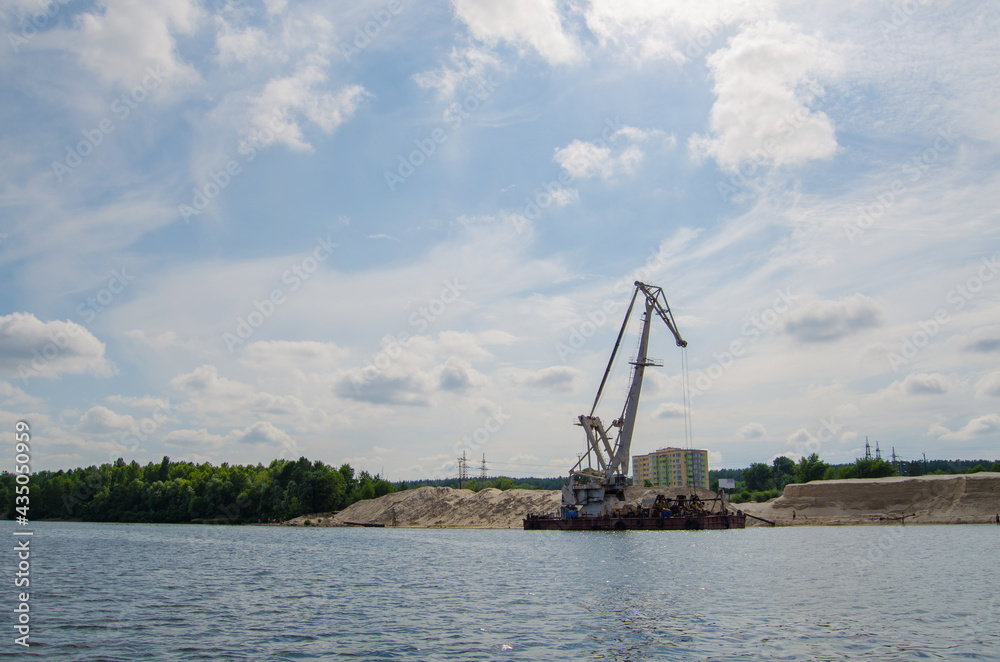 Hoisting and river crane on the Dnieper river near Kyiv, Ukraine Hoisting and river crane on the Dnieper river near Kyiv, Ukraine