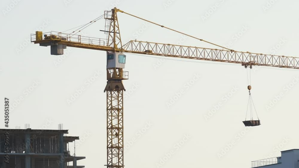 Aerial view of tower cranes and high residential apartment buildings under construction. Real estate development. Aerial view of tower cranes and high residential apartment buildings under construction. Real estate development.