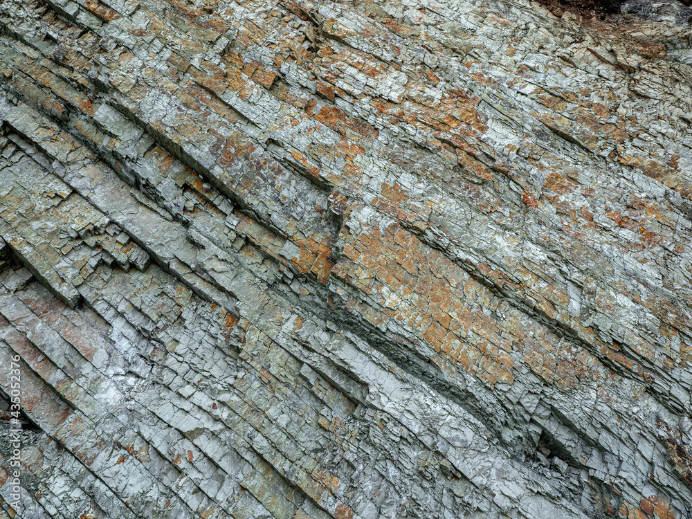 Cross section of rocks. Geological layers. Colored layers of stones in section of the mount, different rock formations and soil layers. Cross section of rocks. Geological layers. Colored layers of stones in section of the mount, different rock formations and soil layers.