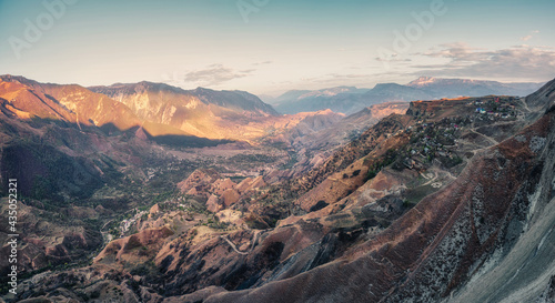 Mountain valley with red mountains. Morning panoramic view of a mountain valley with a serpentine road. Matlas Gorge. photo