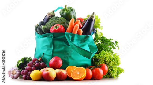 Shopping bag with vegetables and fruits isolated on white