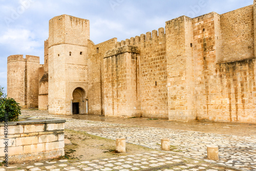 Bild auf Leinwand The huge, majestic walls and towers of Ribat fortress on a rainy day
