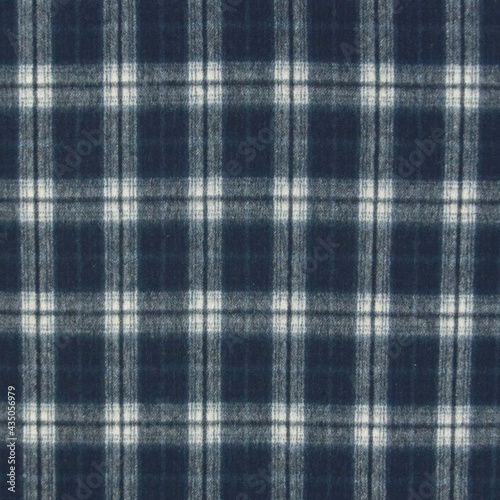 Dark blue checkered plaid wool fabric texture