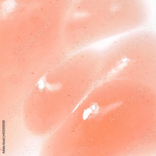 Pink gel exfoliant texture, cosmetic product texture for background