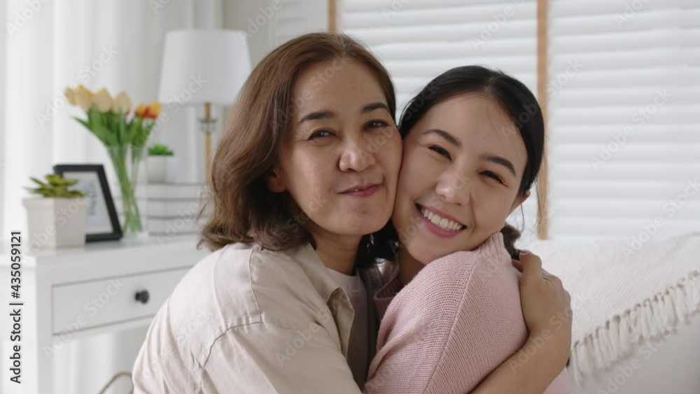 Attractive beautiful mum sit at cozy sofa couch living room in family moment grown up child kid look camera celebrate joy good warm time relationship with retired overjoy lady girl life insurance. Attractive beautiful mum sit at cozy sofa couch living room in family moment grown up child kid look camera celebrate joy good warm time relationship with retired overjoy lady girl life insurance.