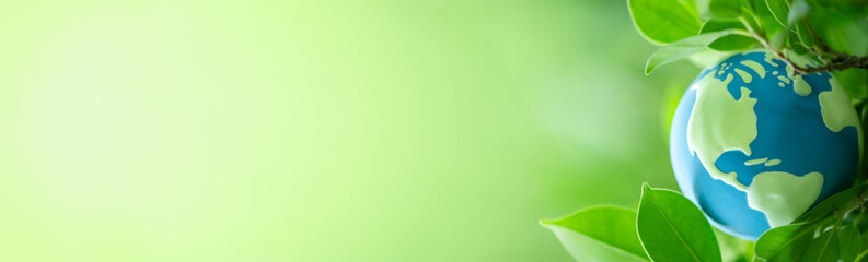 World globe with nature green leaf. Natural fresh plants using as earth ozone day background cover page or world environment day ecology wallpaper