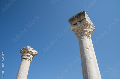 Corinthian style marble columns against blue sky at Perge, once the capital of Pamphylia Secunda, the ancient city near Antalya, Turkey
