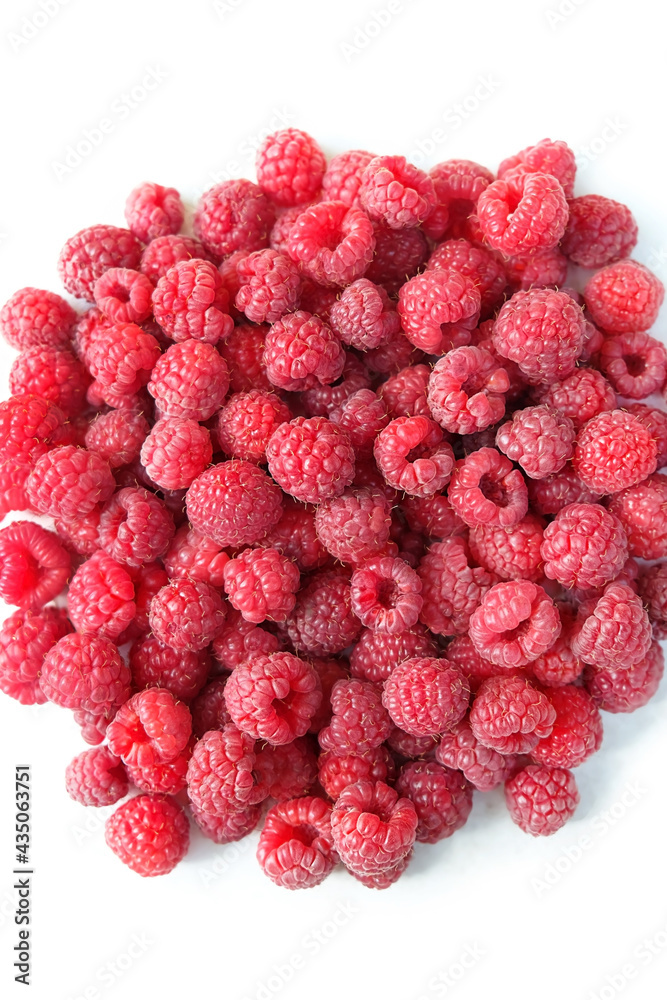 Red raspberry berries pile isolated on white background. sweet ripe Raspberry, vitamins healthy organic food. top view Red raspberry berries pile isolated on white background. sweet ripe Raspberry, vitamins healthy organic food. top view