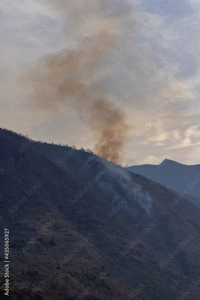 smoke coming out from fire on mountains