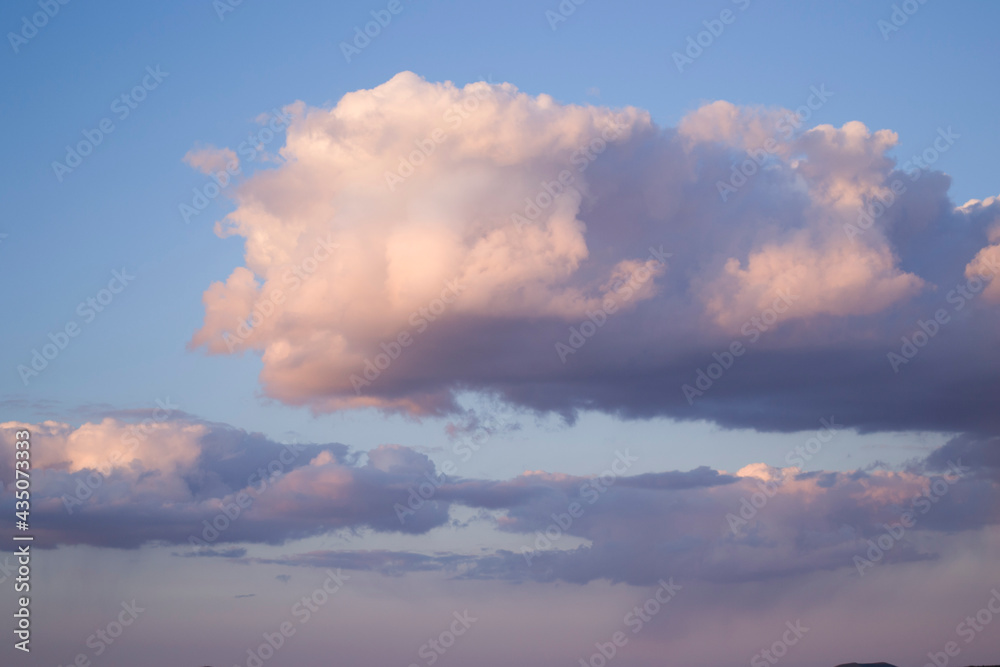 A large cloud against a blue sky.