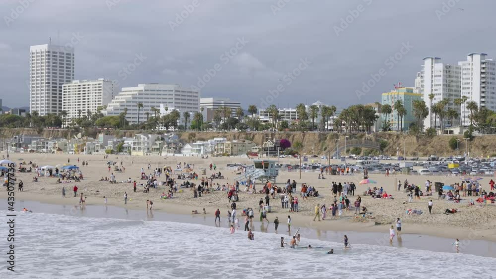 People on the beach in summer and cityscape People on the beach in summer and cityscape