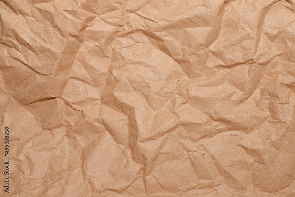 background of crumpled brown paper close-up, place for your text background of crumpled brown paper close-up, place for your text