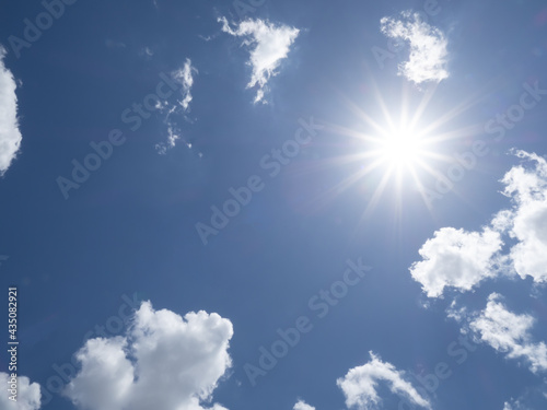Brillant sun shining in blue sky overhead in southwest Florida USA © Jim Schwabel