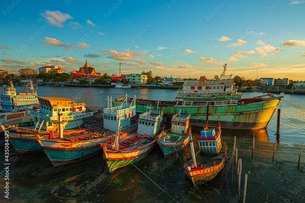 Many boats moored in sunrise morning time at Chalong port, Main port for travel ship to krabi and phi phi island, Phuket, Thailand