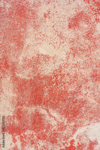 Red plaster texture. The rough surface of the wall of an old house. © sandipruel