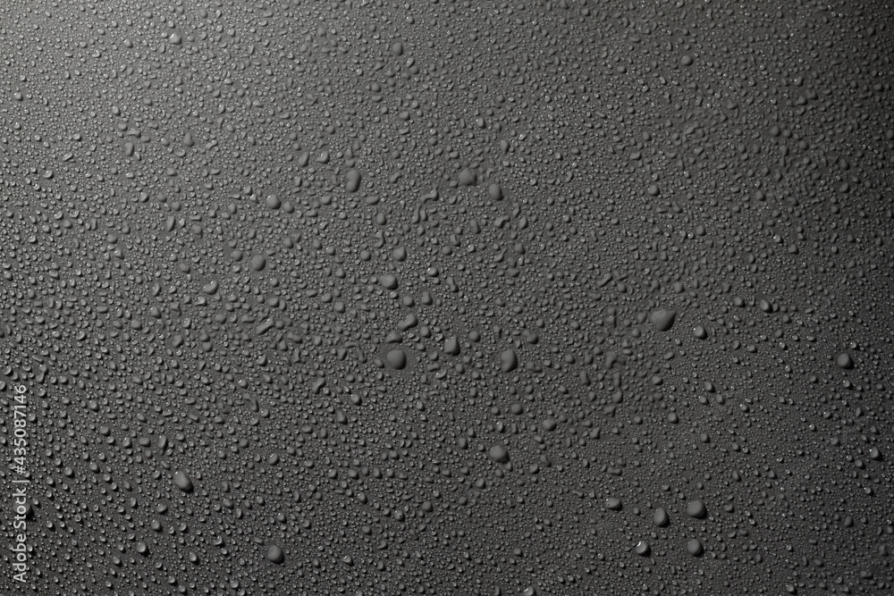 Water drops on a gray surface, a beautiful pattern of water splashes on the background - obrazy, fototapety, plakaty 