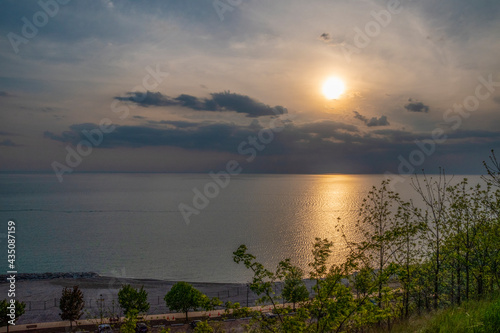 The sun sets over Lake Huron as seen from Bingham Butterfly Park in Goderich, Ontario.
