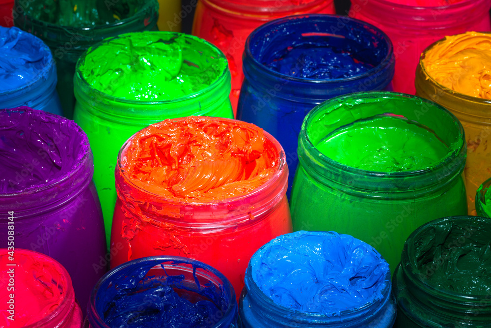the red of plastisol ink for print tee shirt in the glass bucket. colorful  of ink background.. Stock Photo