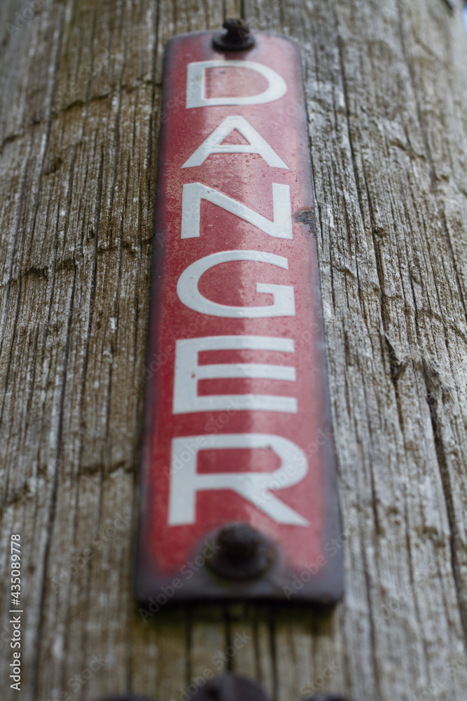 A warning sign to people about the danger of electricity A warning sign to people about the danger of electricity