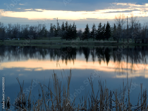 Sunset after a storm by the lake