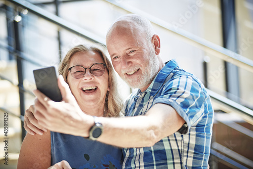Playful senior couple taking selfie