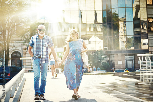 Wallpaper Mural Mature couple walking around Old town on sunny day Torontodigital.ca