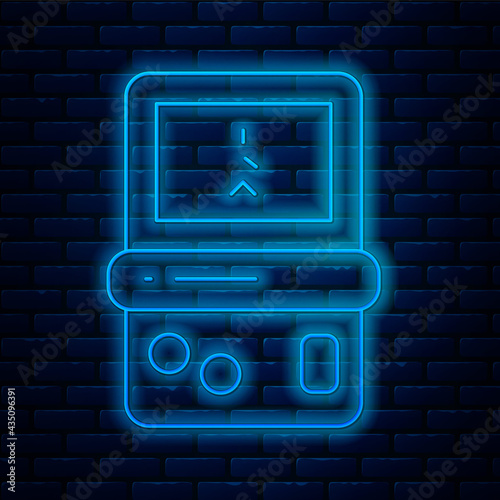 Glowing neon line Portable tetris electronic game icon isolated on brick wall background. Vintage style pocket brick game. Interactive playing device. Vector