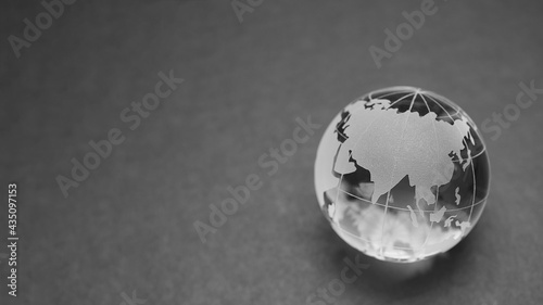 Map of Asia on a crystal globe Dark background