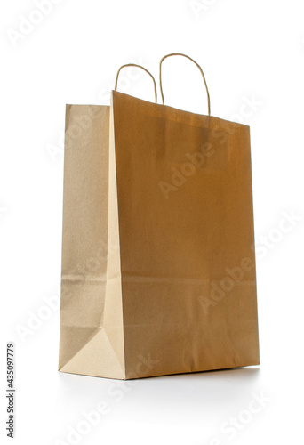 Old paper bag. Brown package with kraft recycle texture, empty blank space for design mockup isolated on white background. Delivery service concept. Copy space. Advertising area.