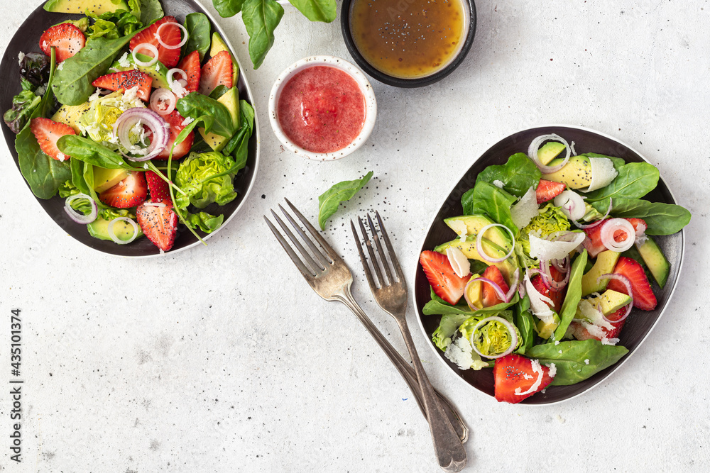 Summer salad with strawberries, avocado and poppy seeds. Healthy food. Summer salad with strawberries, avocado and poppy seeds. Healthy food.