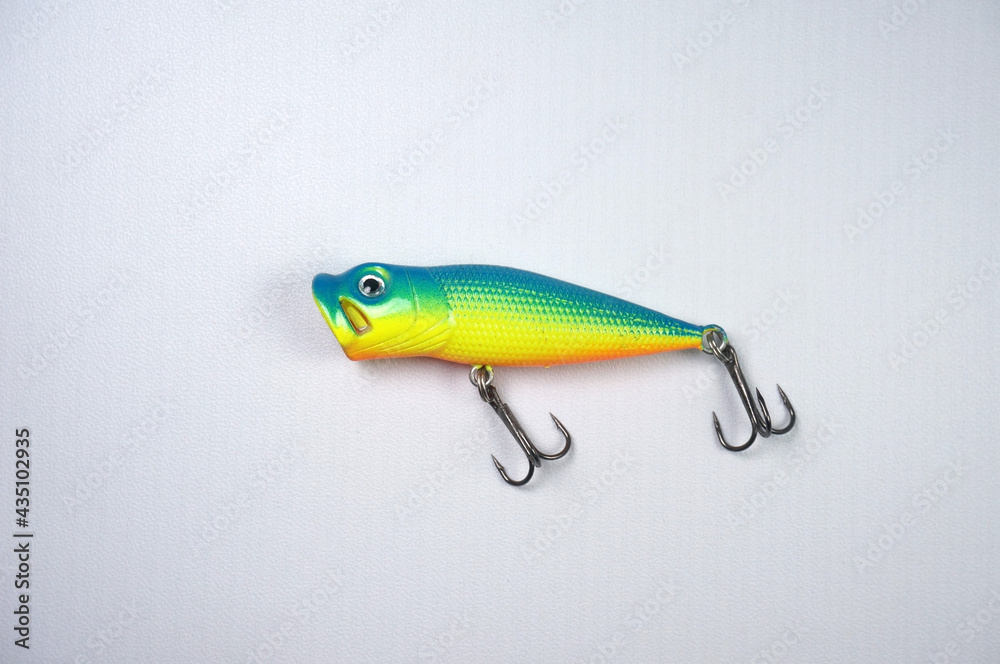 Plastic fishing lure on a white background. Home made fishing lure.   