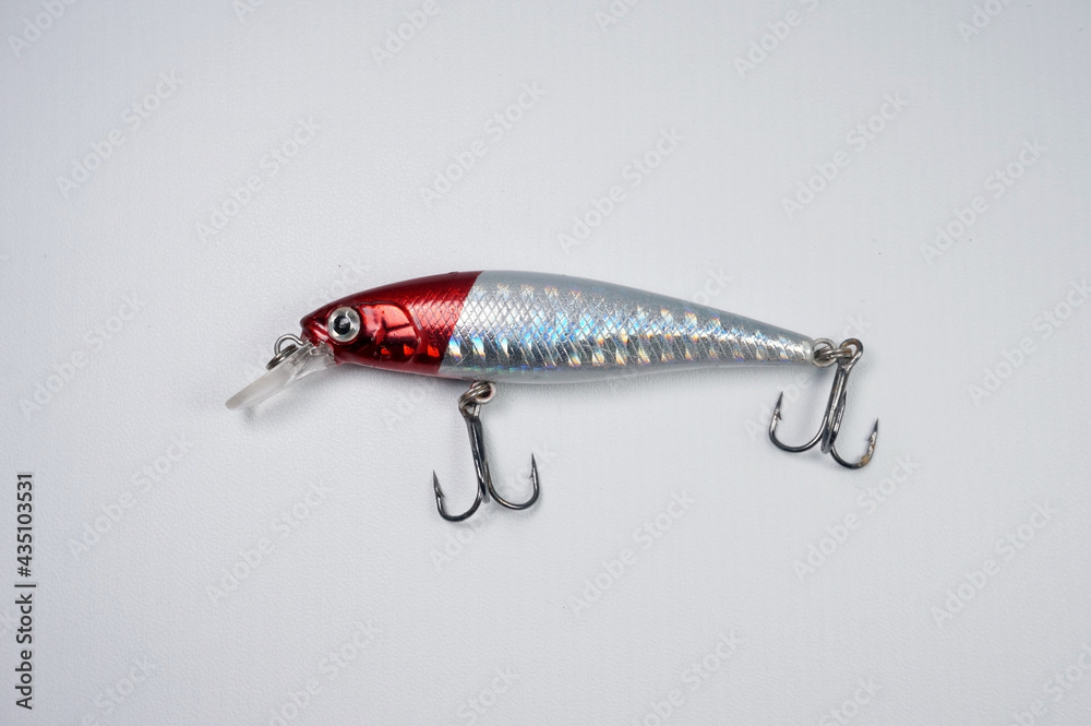 Plastic fishing lure on a white background. Home made fishing lure. Plastic fishing lure on a white background. Home made fishing lure.