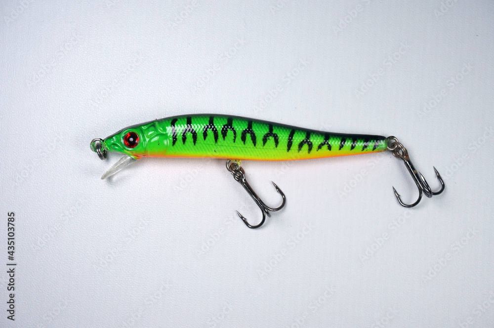 Plastic fishing lure on a white background. Home made fishing lure. Plastic fishing lure on a white background. Home made fishing lure.