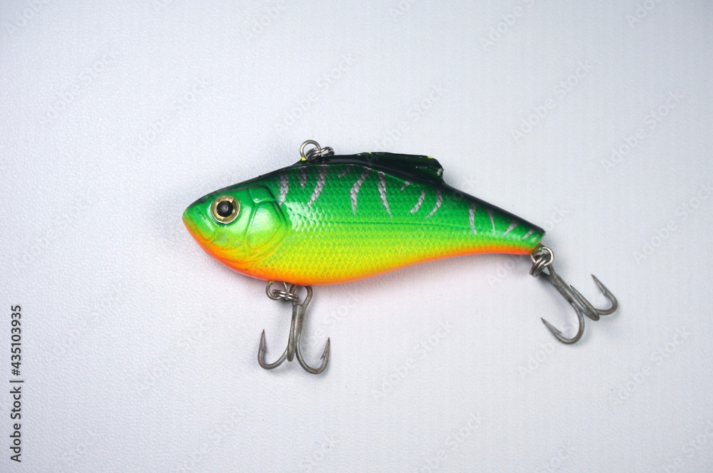 Plastic fishing lure on a white background. Home made fishing lure. Plastic fishing lure on a white background. Home made fishing lure.