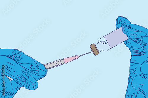 vaccine is being taken out from a vial into an injection syringe photo