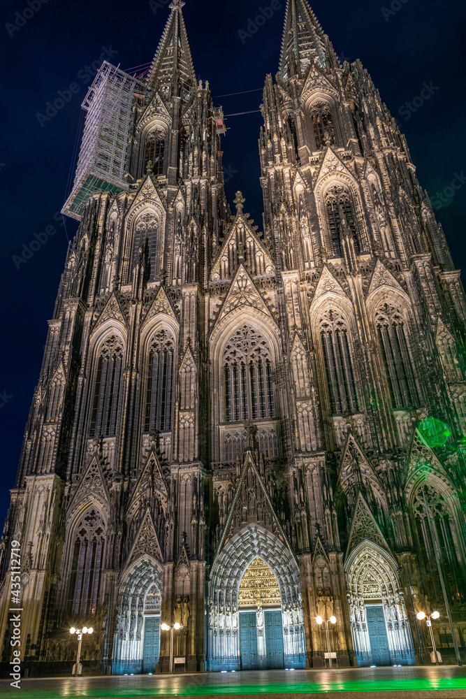 Facade of Cologne Cathedral at night in Germany