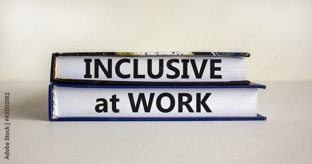 Obraz premium Inclusive at work symbol. Books with words 'Inclusive at work' on beautiful white background. Business, inclusive at work concept. Copy space.