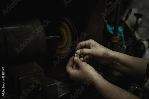 Close-Up Of Repairing Ring By Polishing Motors Tool