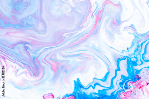 Fluid art. Abstract lilac pink background. Liquid marble texture design. Blue pink pattern