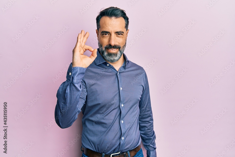 Middle age man with beard and grey hair wearing business clothes smiling  positive doing ok sign with hand and fingers. successful expression. Stock  Photo | Adobe Stock