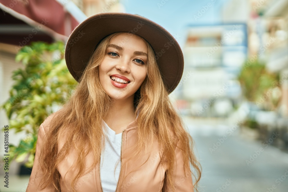 Young blonde girl smiling happy standing at the city. Young blonde girl smiling happy standing at the city.