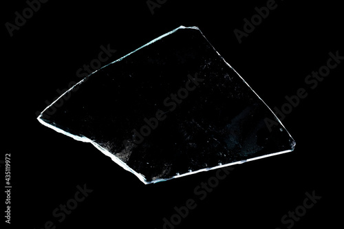 Obraz na plátně piece of broken glass insulated on a black background