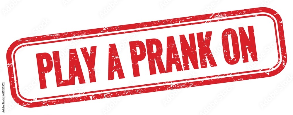 PLAY A PRANK ON text on red grungy vintage stamp. PLAY A PRANK ON text on red grungy vintage stamp.