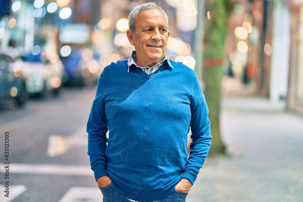 Senior grey-haired man smiling happy standing at the city. Senior grey-haired man smiling happy standing at the city.